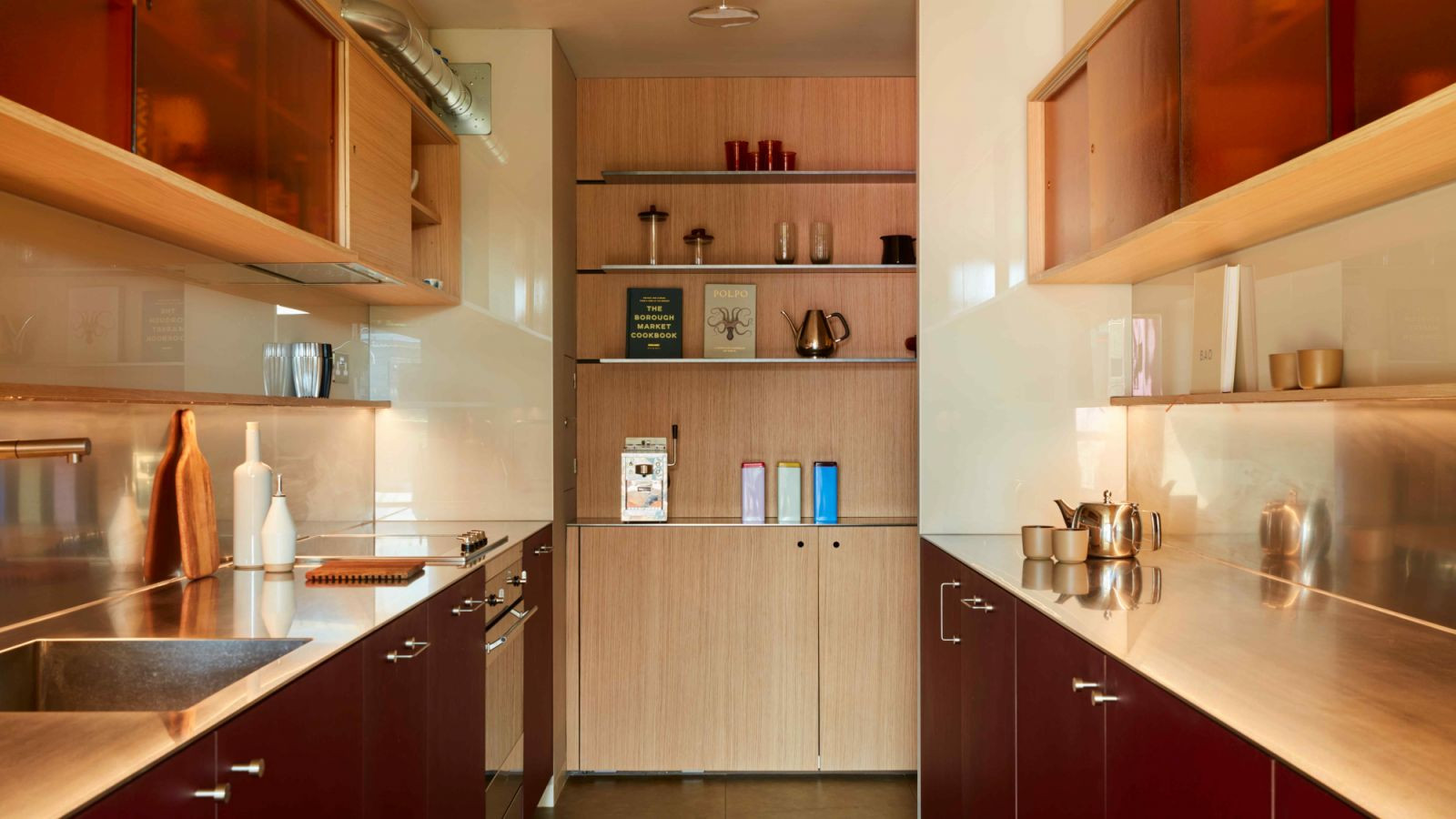 The bespoke kitchenette makes the space more practical for modern living (Photo: Black & Milk)