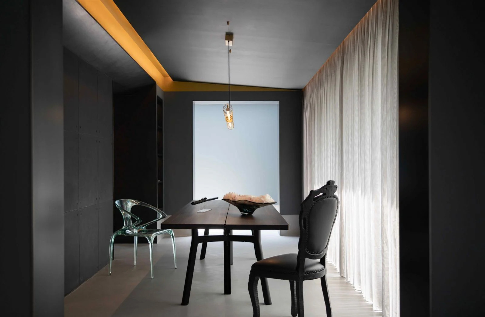 The canted ceiling with recessed lighting in PING Design’s Beijing residential project resembles a ray of light tearing through the dark sky (Photo: Zheng Yan)