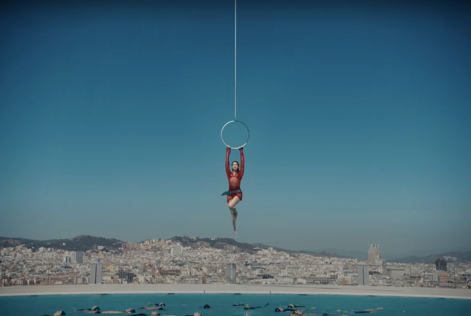 Dua Lipa’s “Illusion” was shot at Barcelona’s Olympic-era Piscina Municipal de Montjuïc, is travel mood board meets fitness inspo. These music videos could inspire your next destination. (Photo: YouTube)