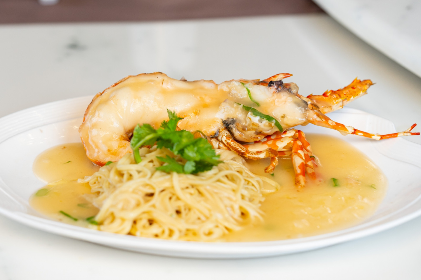 Tiger lobster in superior sauce with noodles by East Ocean Palace