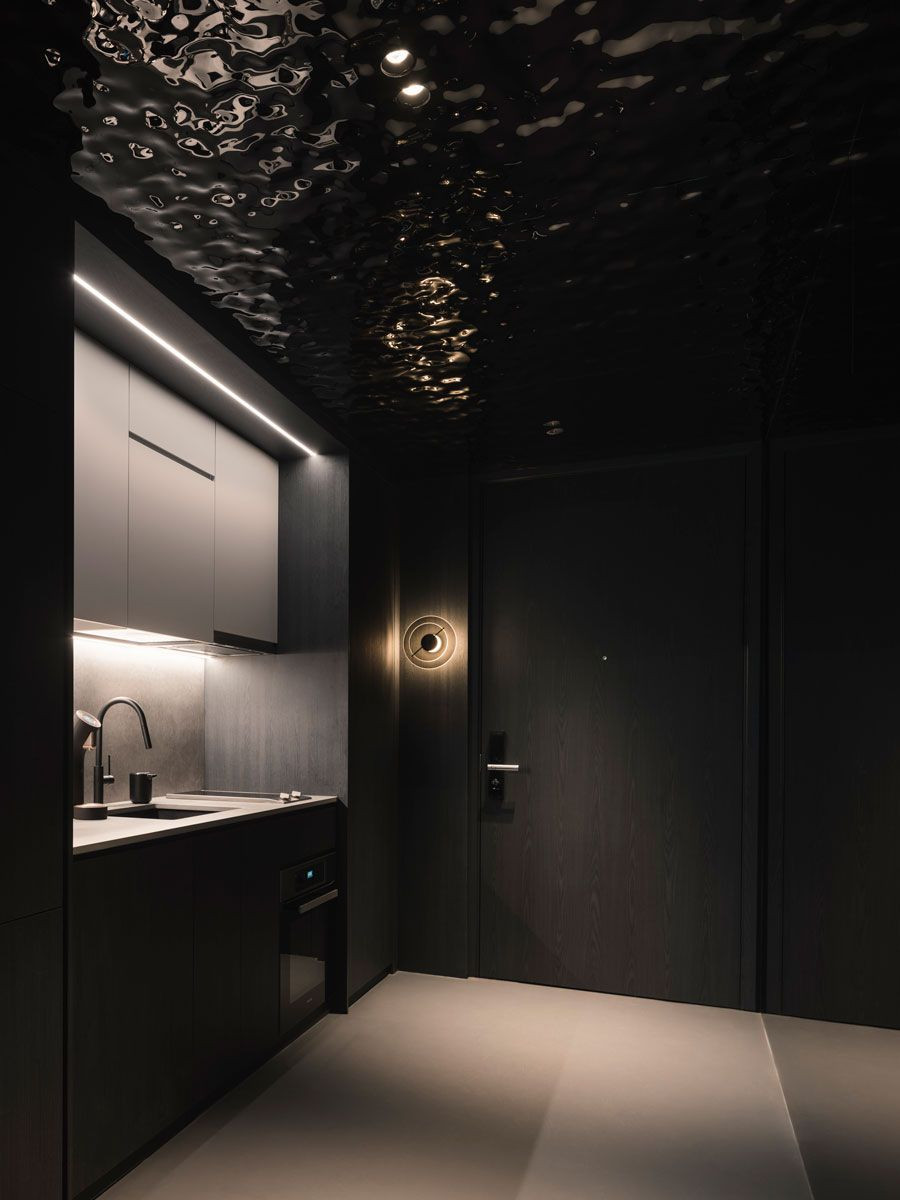 A hammered-metal ceiling in the entryway creates visual interest with its light-catching effect