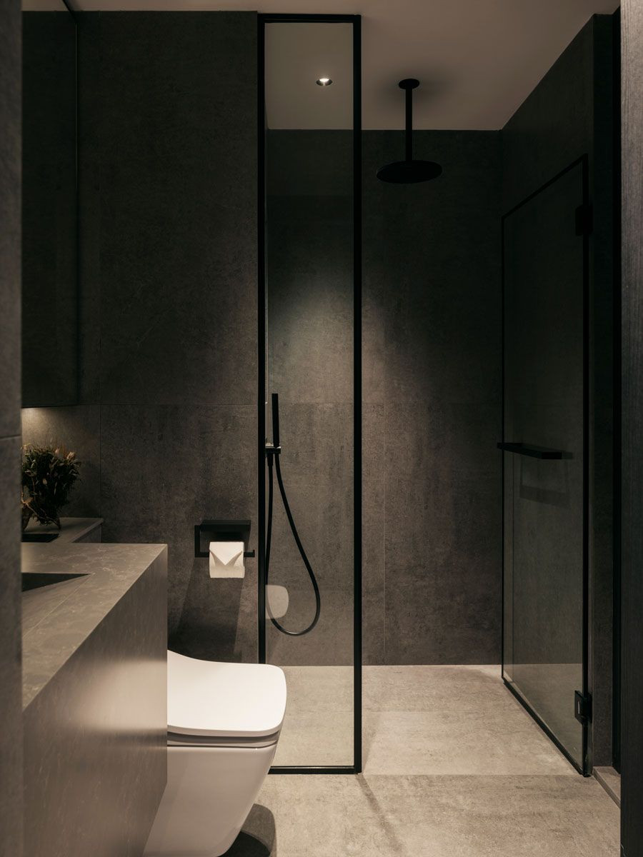 The understated bathroom continues the modern minimalist design concept of the home
