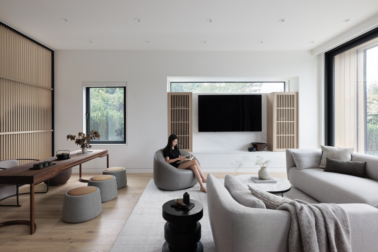 The main living area demonstrates the open floor plan with strategic areas for refuge, featuring the Cosy Sofa by MDF and Minotti Torii Coffee Table as specified in the furniture sourcing