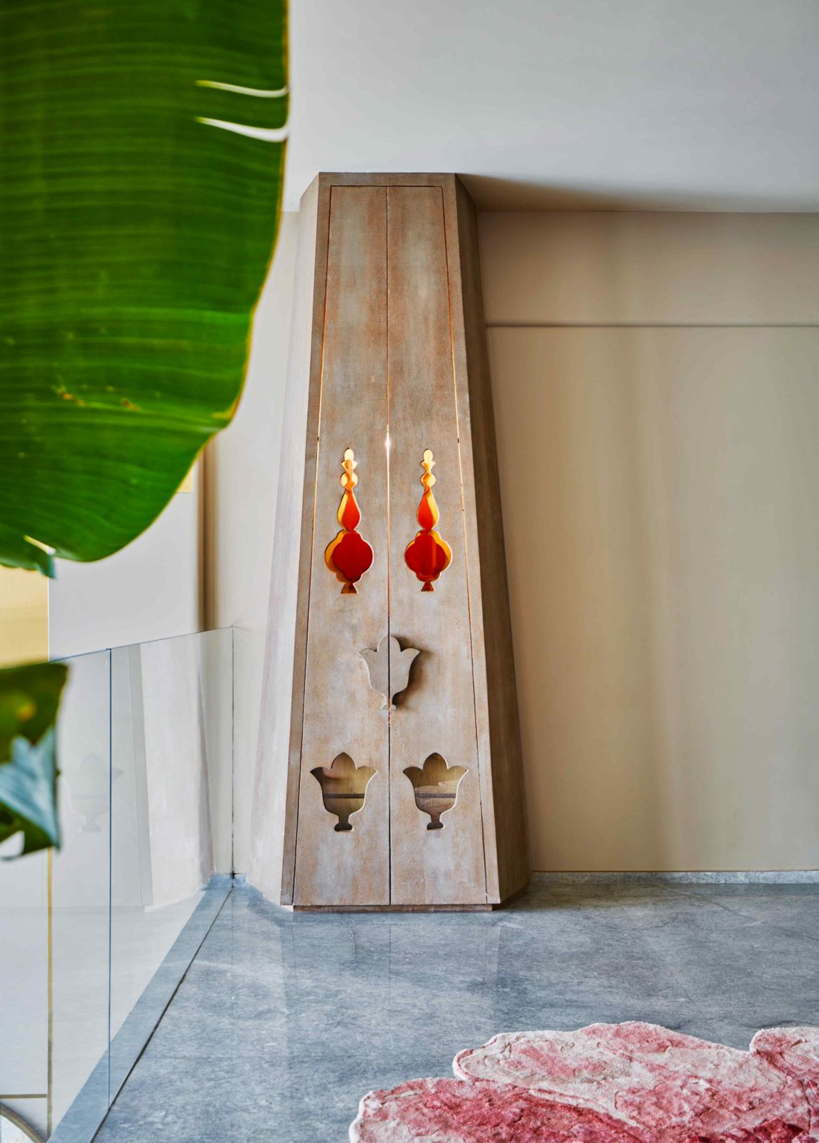 A hidden mandir behind shutters with lotus motifs in the upper level’s lounge area (Photo: Aspire Studios)