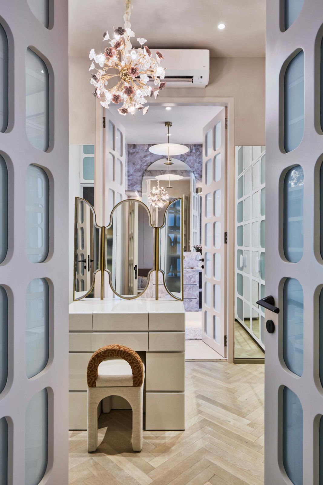 The walk-in wardrobe hidden behind French panels in the master bedroom (Photo: Aspire Studios)