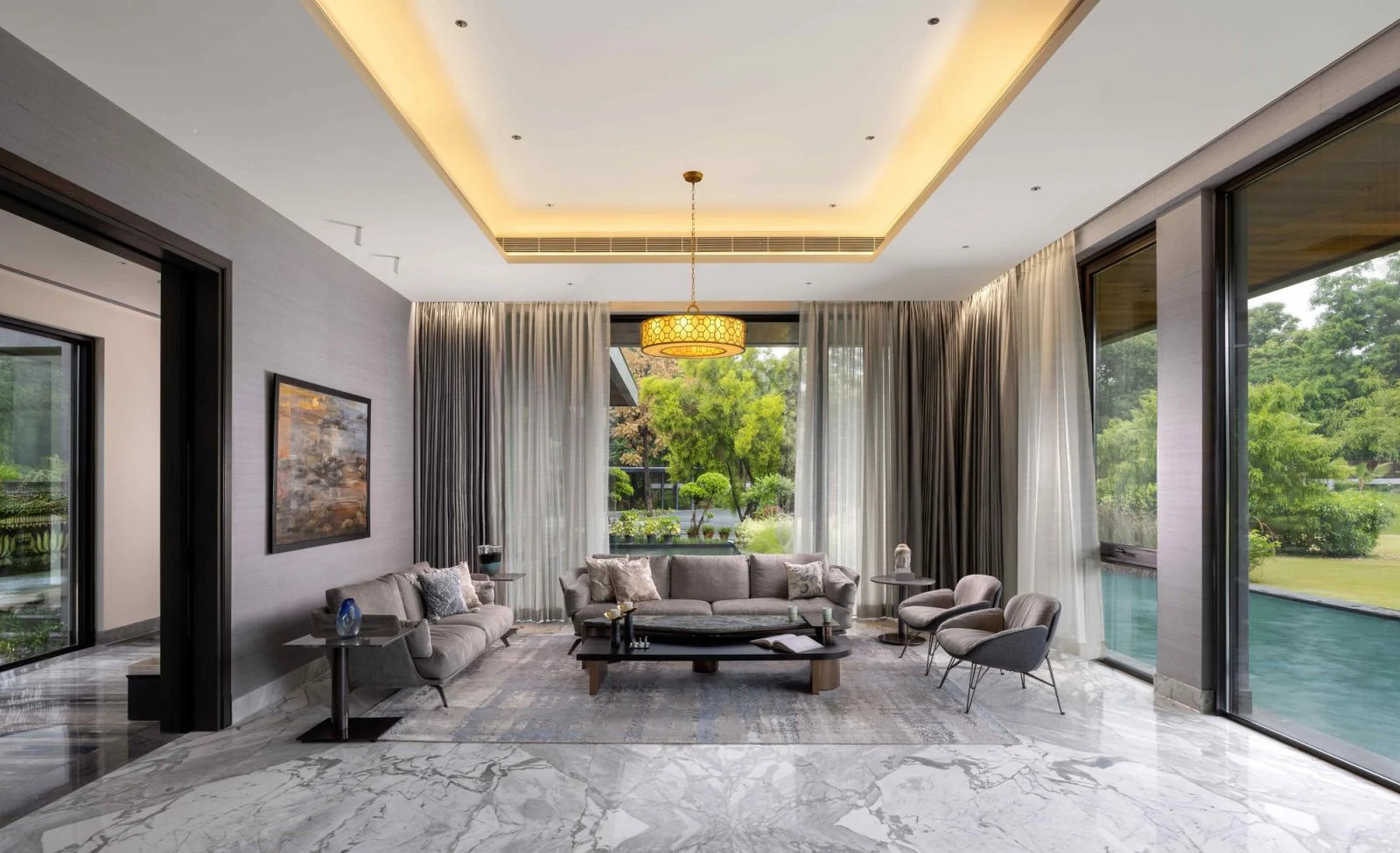 Natural light floods through expansive windows that frame views of the courtyard (Photo: Zcyphher)