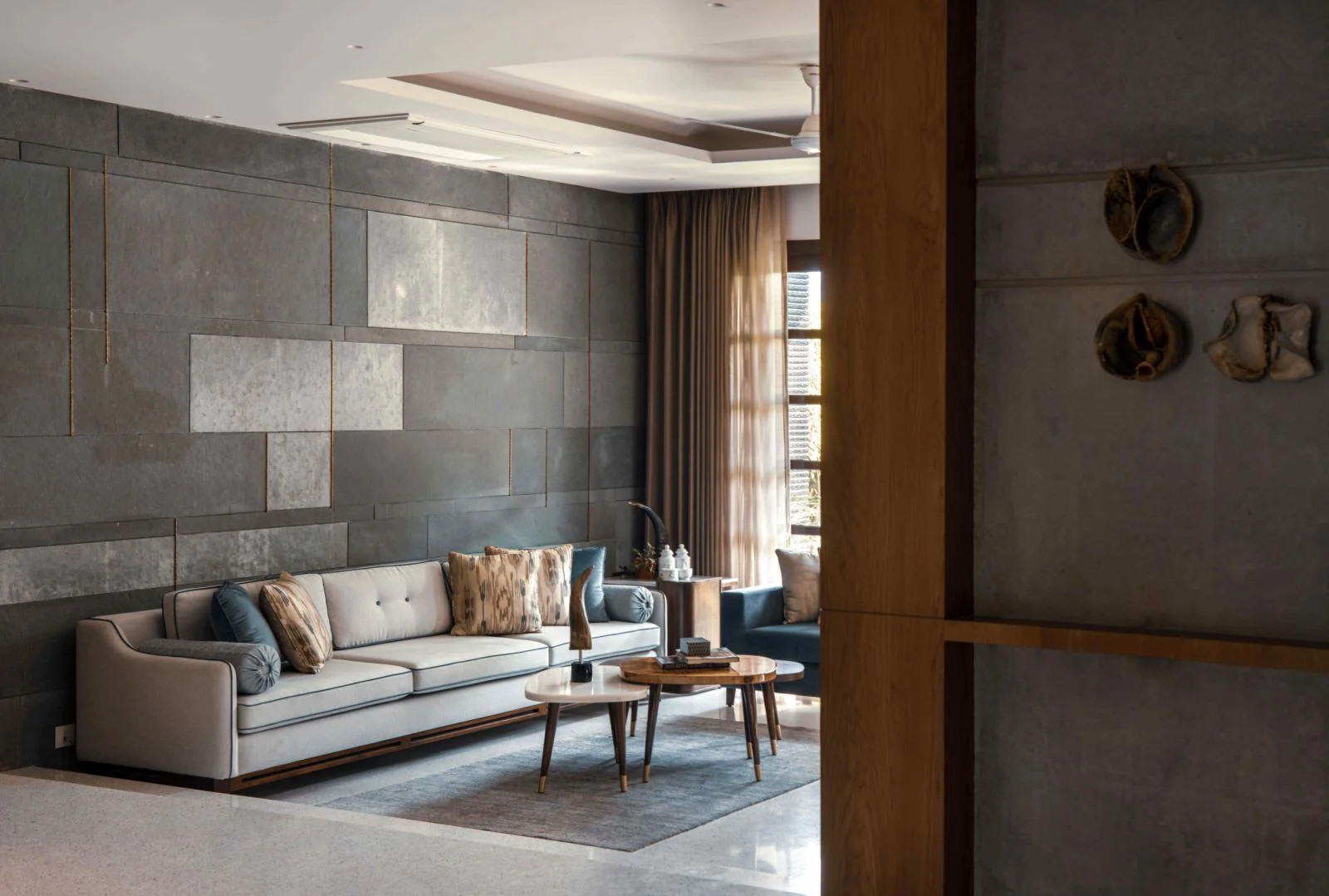 The kota stone feature wall interwoven brass accents (Photo: Untitled Design Consultants)
