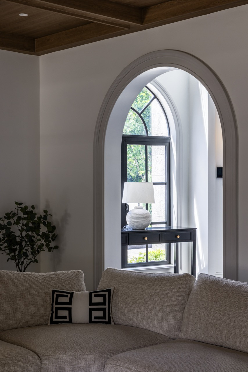 Arched doorways frame views throughout the home