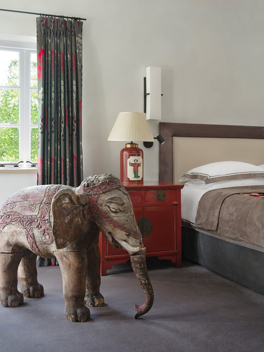 The bedroom of an Arts and Crafts mansion in Buckinghamshire, England restored by the Tollgard Studio