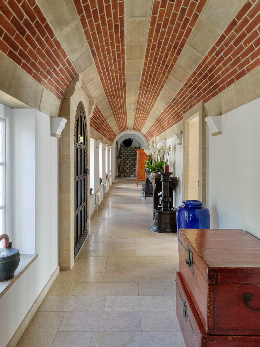 The hallway of an Arts and Crafts mansion in Buckinghamshire, England restored by the Tollgard Studio
