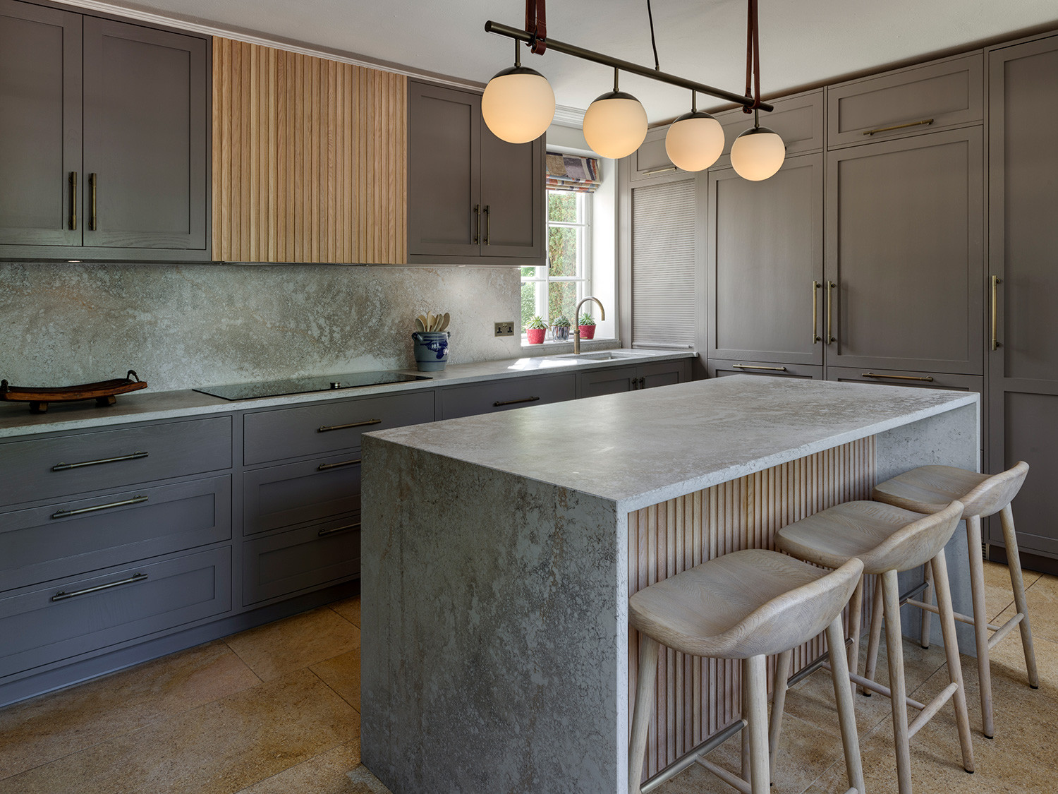 The kitchen of an Arts and Crafts mansion in Buckinghamshire, England restored by the Tollgard Studio