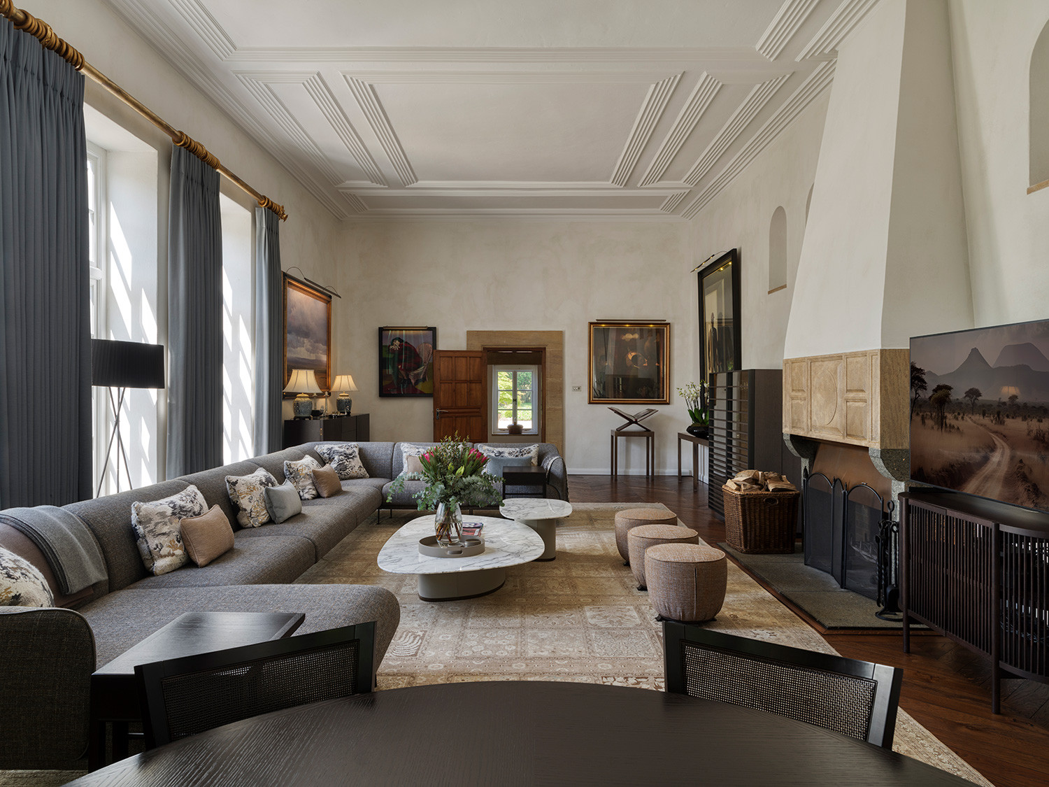 The living room of an Arts and Crafts mansion in Buckinghamshire, England restored by the Tollgard Studio