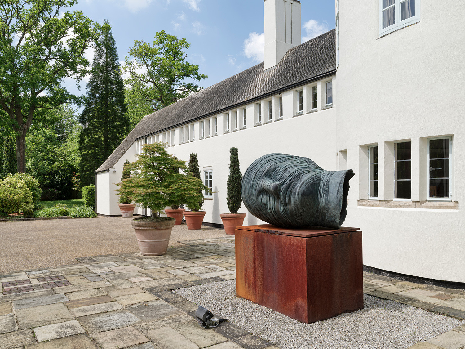 The exterior of an Arts and Crafts mansion in Buckinghamshire, England restored by the Tollgard Studio