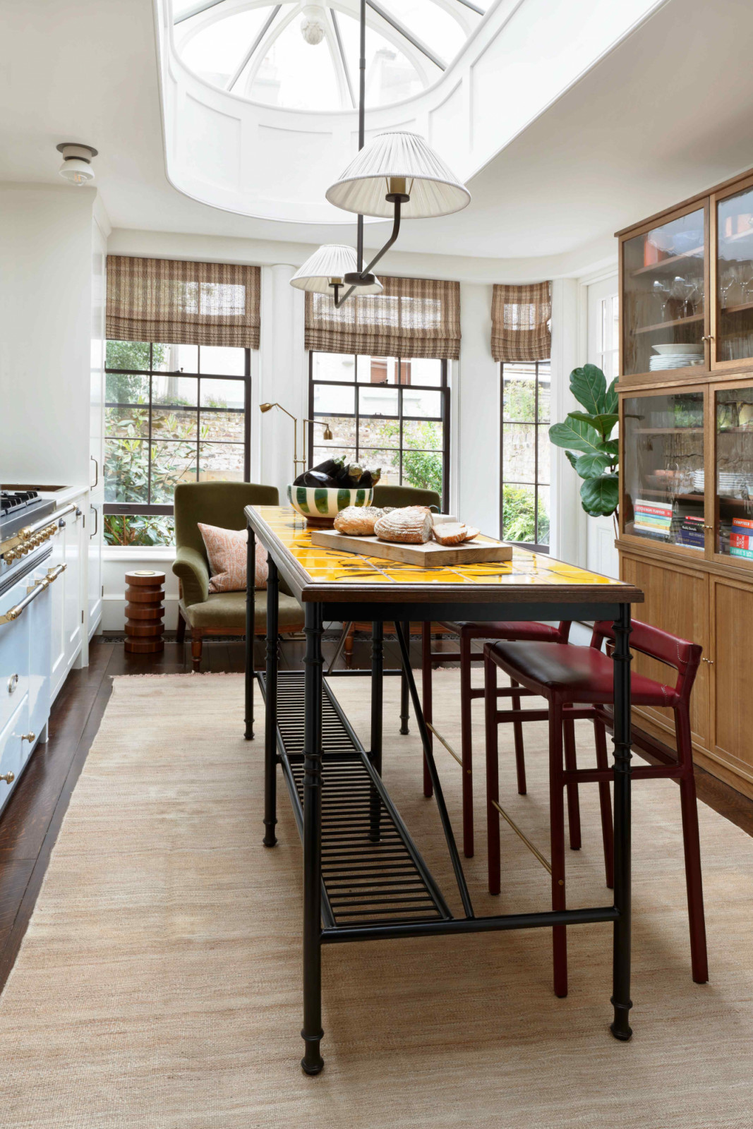 A bespoke island designed by Christian Bense with hand-painted tiles by Freyja Lee