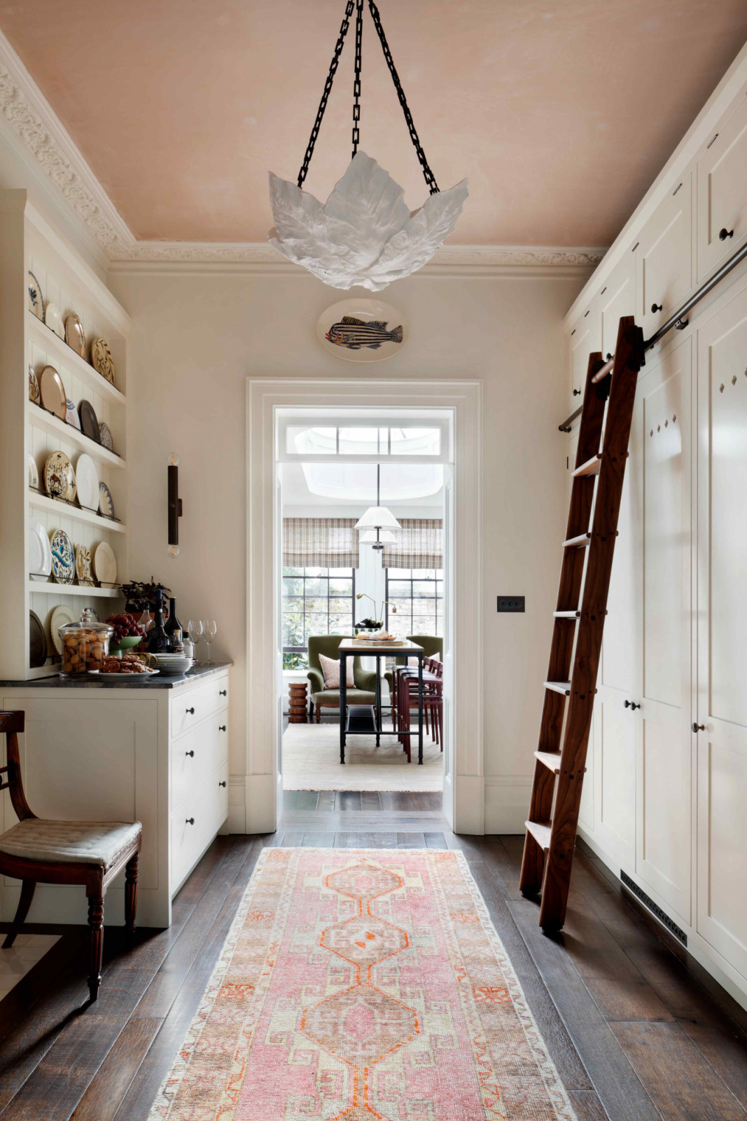 The “middle room” doubles as a pantry, and a passage that leads to the dining room