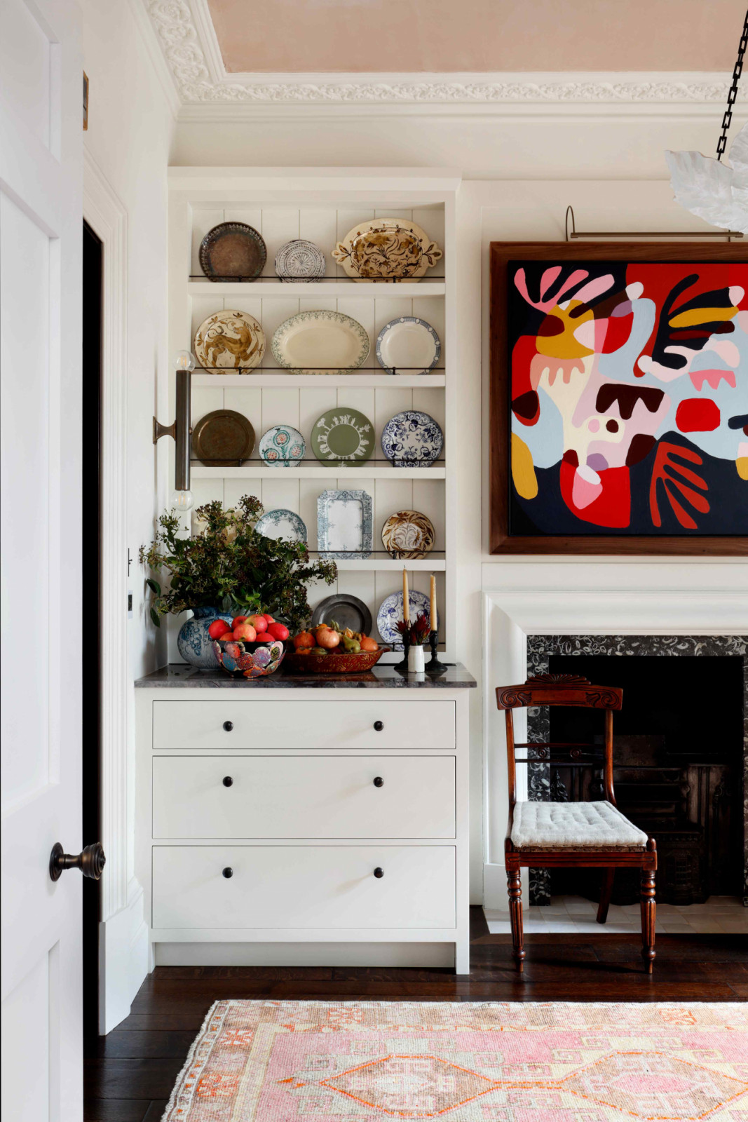 Clever storage solutions adorned with ceramics bring about a country house charm