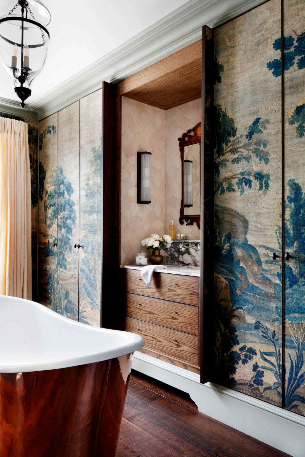 The Watts 1874 Wolterton Verdure wallpaper decorates the master ensuite