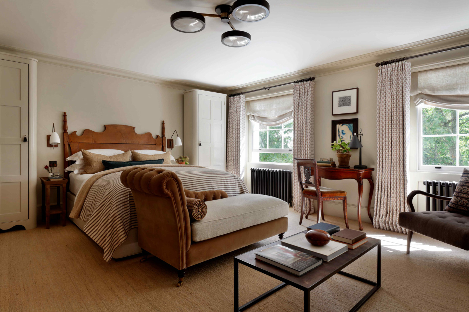 The guest bedroom with a wooden furnishings bringing about a traditional English charm