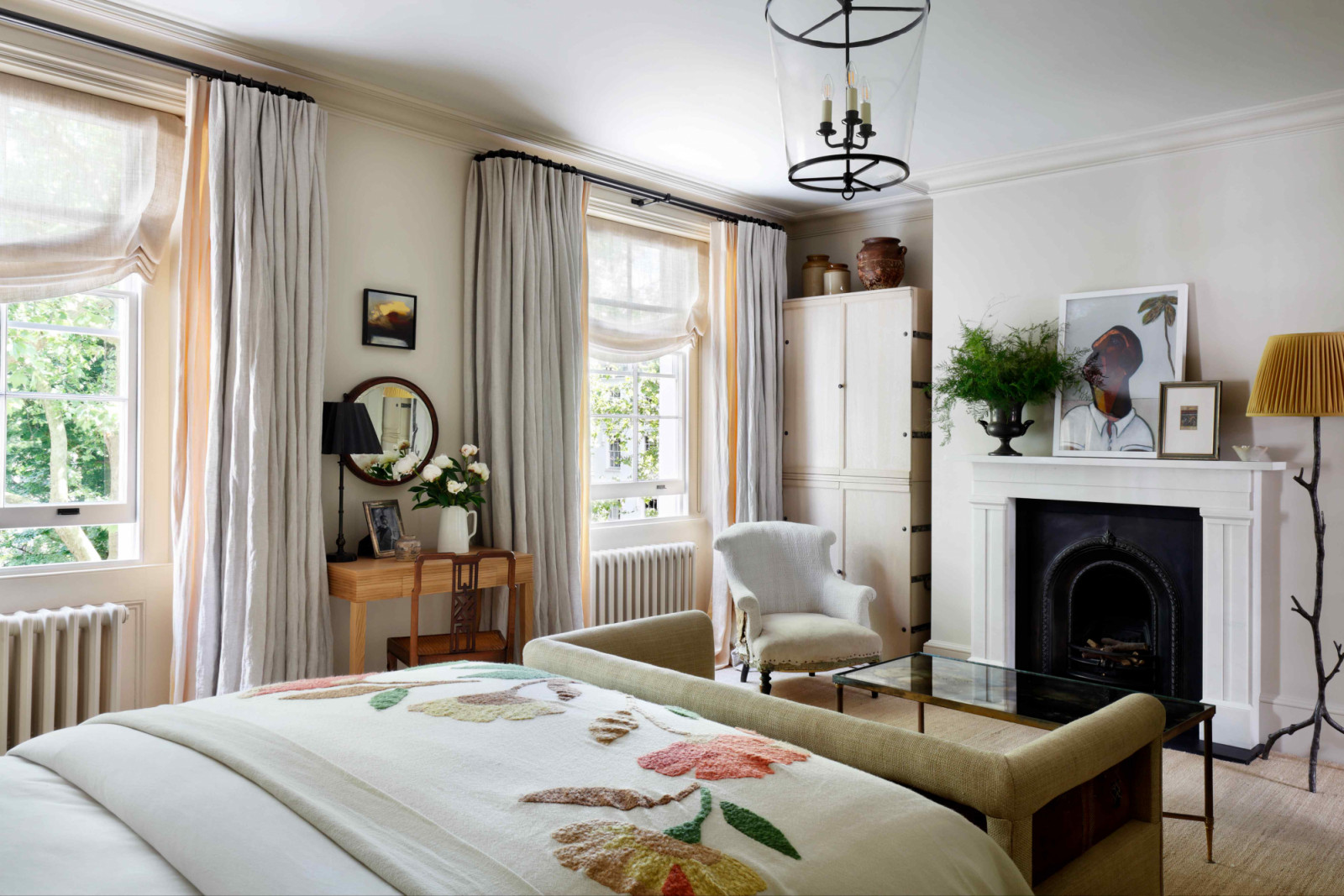 The principal suite with sheer drapes in buttermilk mimicking the dappled sunlight filtering through leaves