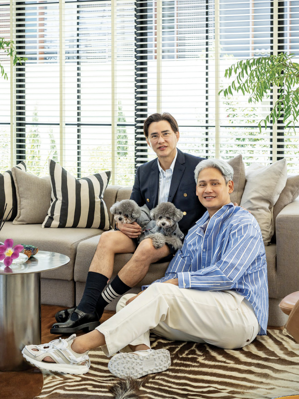 Tan and Quong in their living room with their beloved poodles, Khloe and Kylie