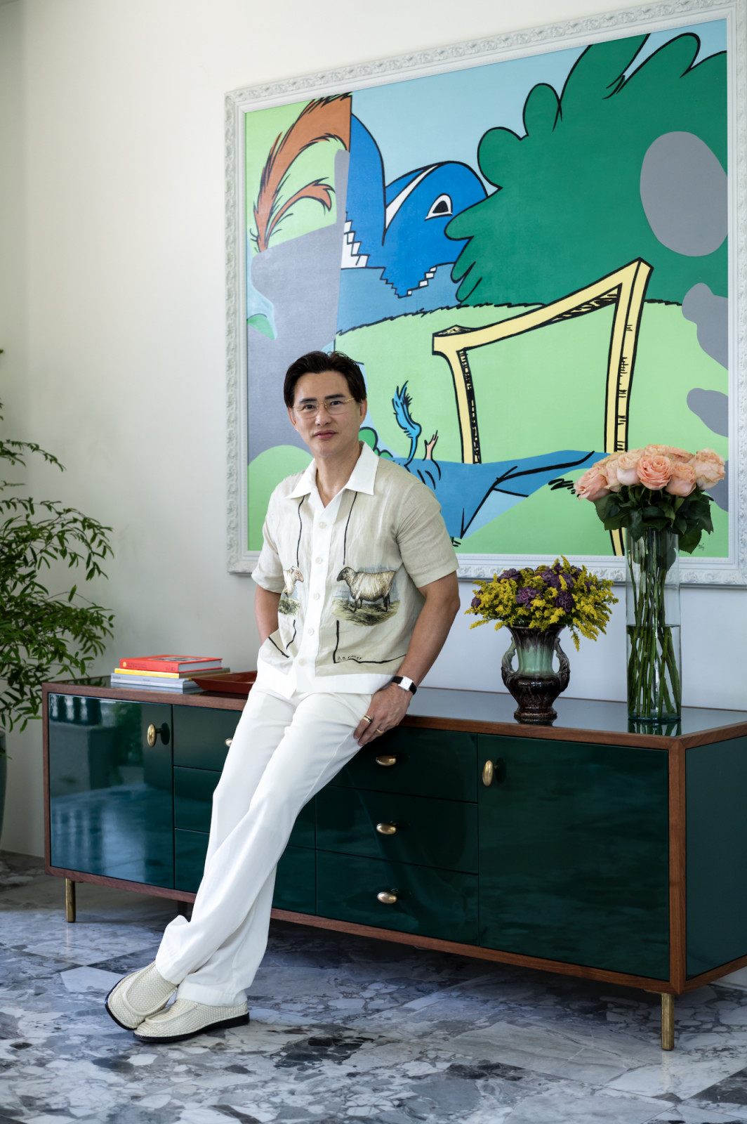 Steven Tan in the foyer of his entry with an RM de Leon artwork gifted by Hans Sy