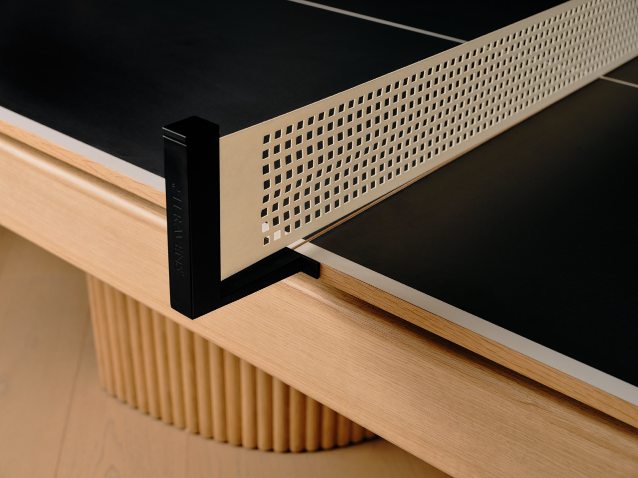 Close-up of the precision ping pong net system