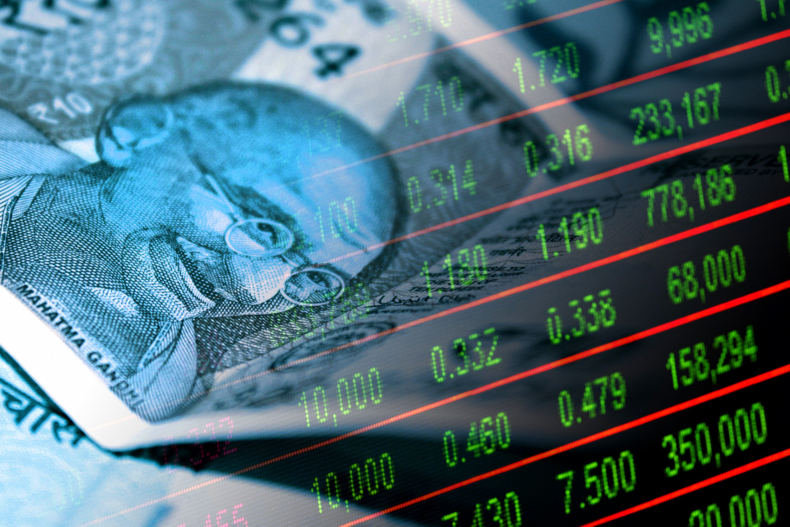 Indian rupee cash bills and stock market indicator board (money, economy, business, finance, inflation, crisis) (ภาพ: Javier Gherisi)