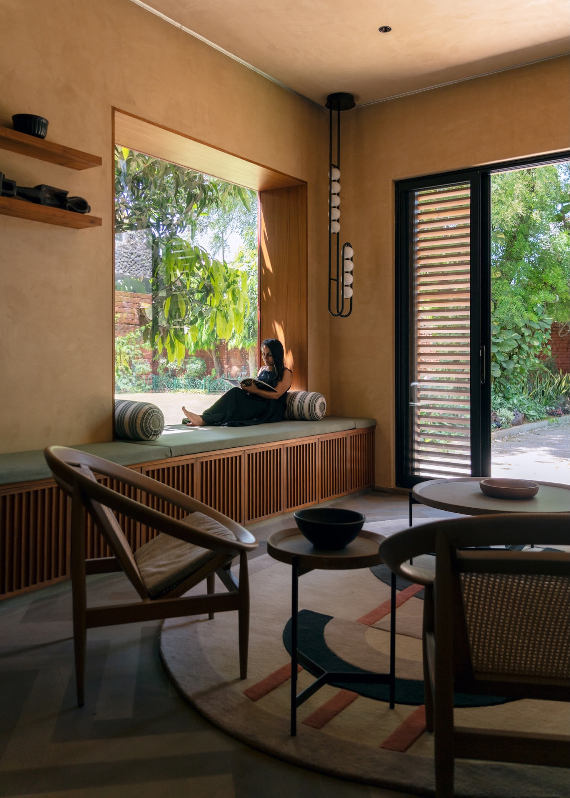 Inside the living room, dining room and kitchen of a home in Gwalior, India brought to life by Studio Dashline