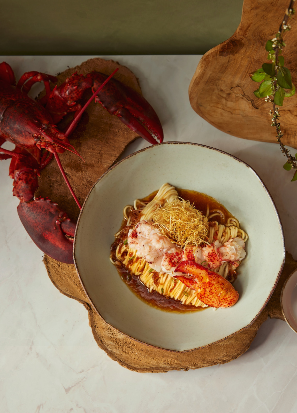The outlet-exclusive Premium Lobster Dry Noodle in Chef's Seafood Sauce Weave at Resorts World Sentosa