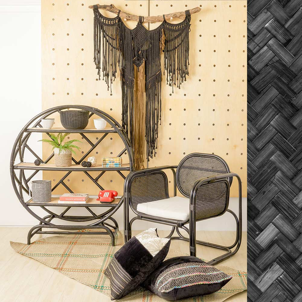 A circular rattan shelving unit and cane-backed chairs from Rotan Lot exemplify the brand’s approach to sustainable design (Photo: Rotan Lot)