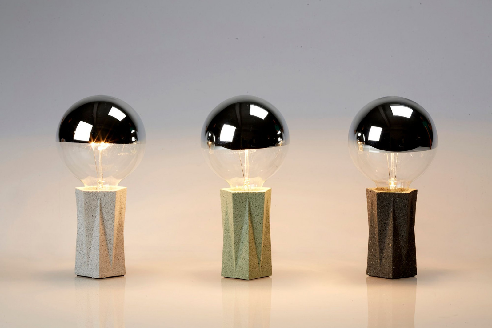 Aureole Design's Geometry series explores the art of paper folding through the base of the lamps and bulbs