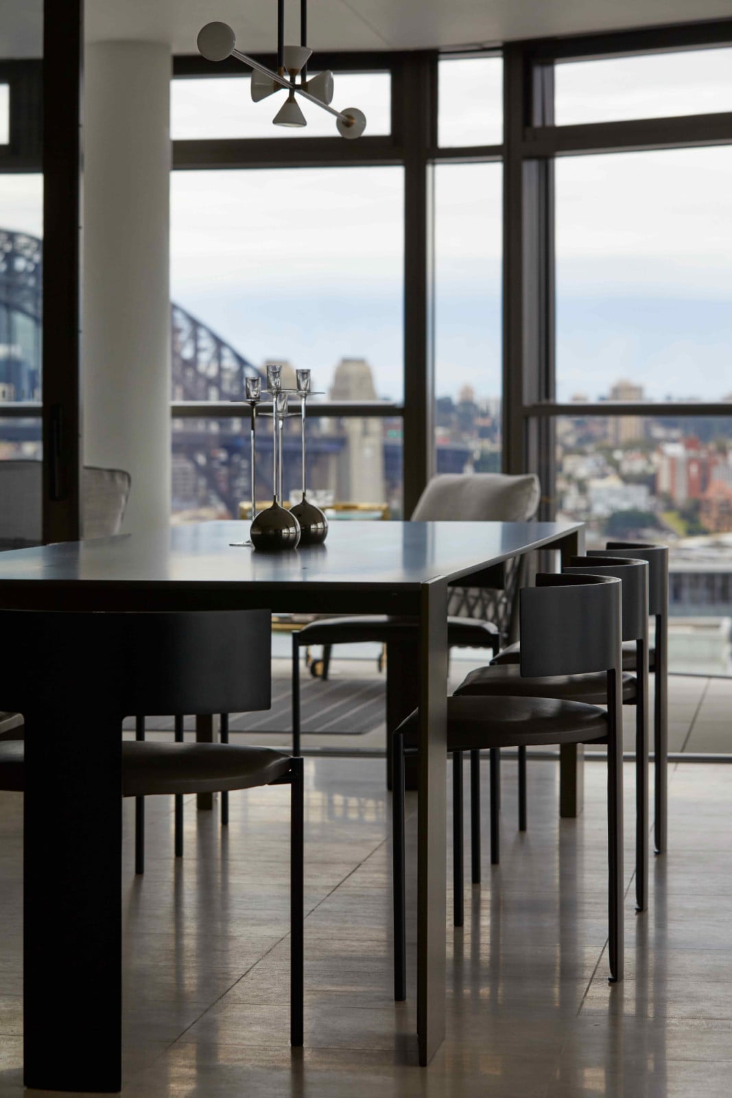 A Metallico dining table by Living Divani paired with Baxter Zefir dining chairs