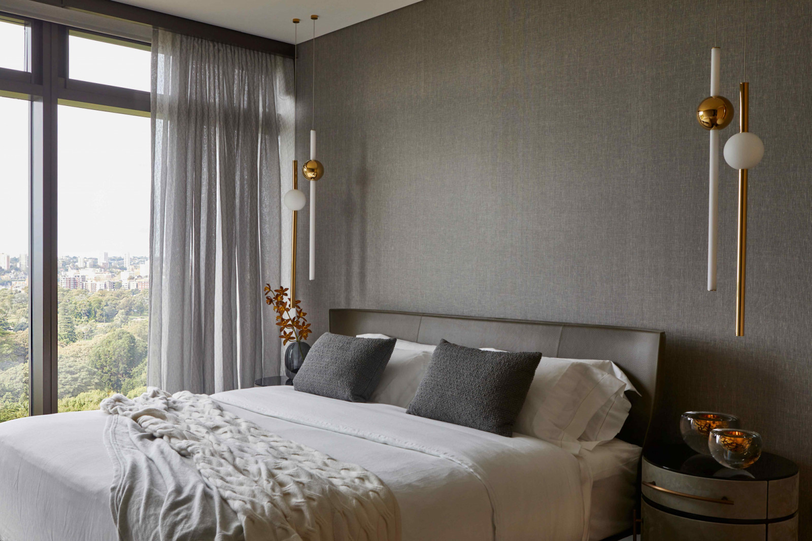 The bedroom features a Lee Broom Eclipse pendants and Poliform Onda bedside tables