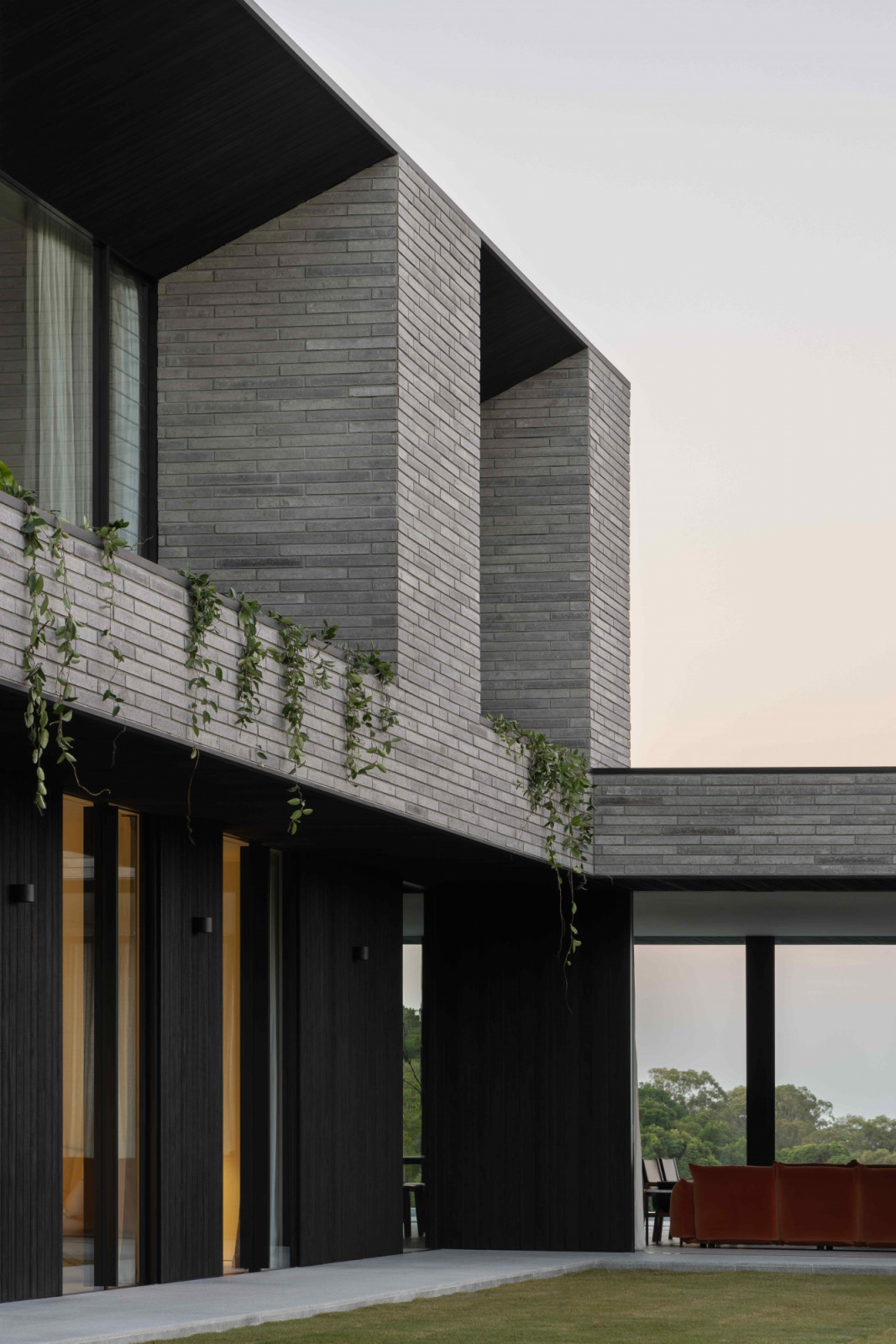SPACE Atelier’s interior design matches the building’s soaring volumes and use of raw materials