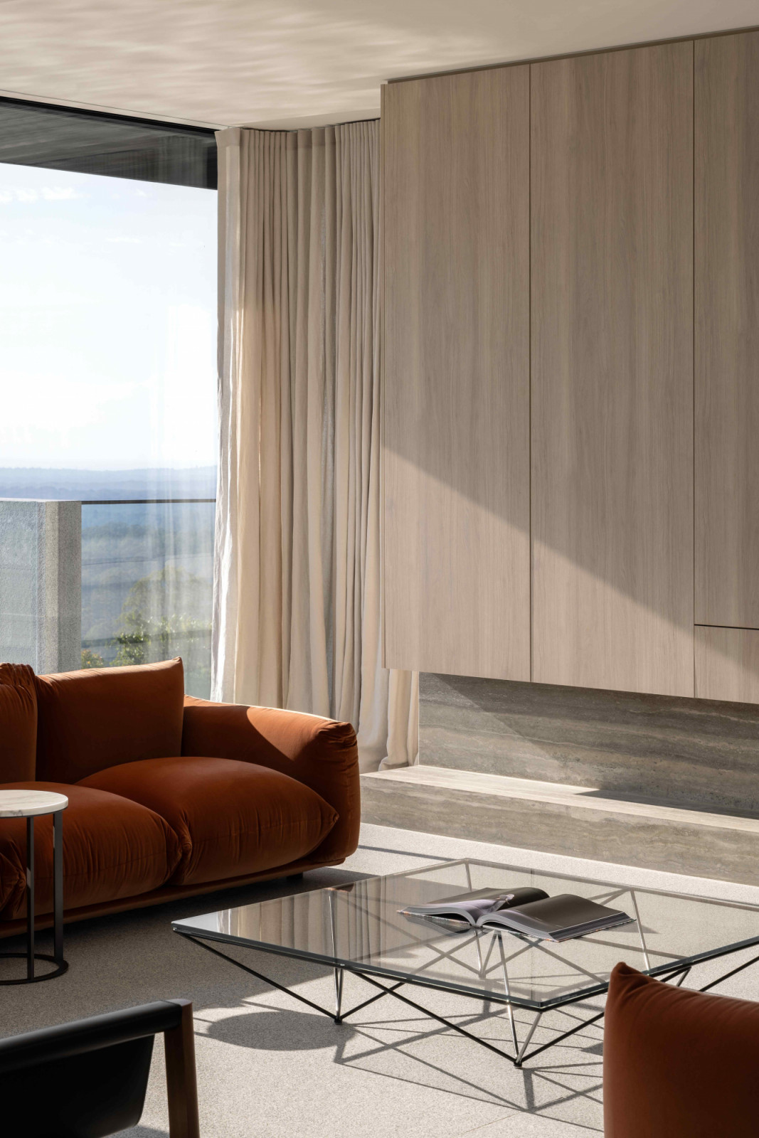An interplay of light and shadow upon the geometric shapes of the Alanda table by B&B Italia
