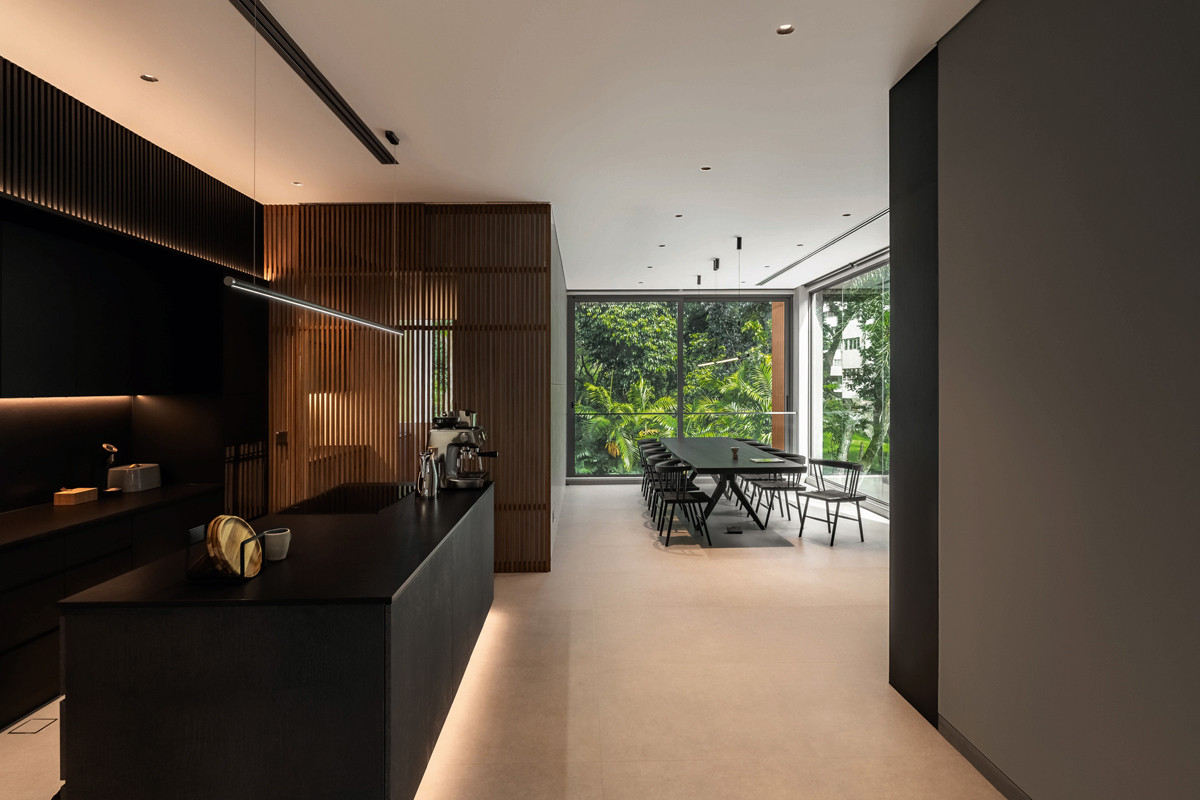 The semi-detached home’s harmonious interplay of light and dark materials creates a richly layered spatial experience