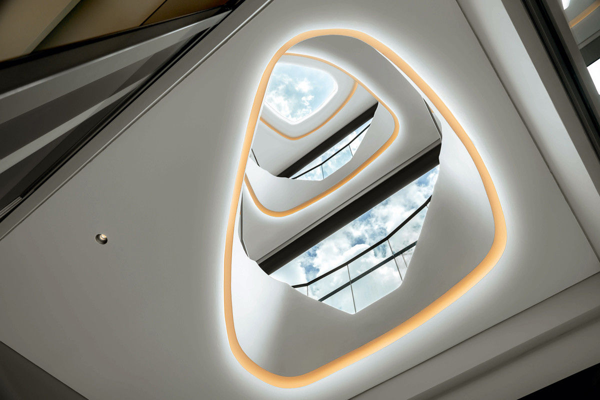 The semi-detached home’s organic-shaped light well makes a dramatic impression from the ground floor
