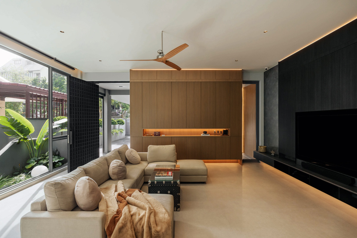 A feature wall shields the semi-detached home’s living room from view