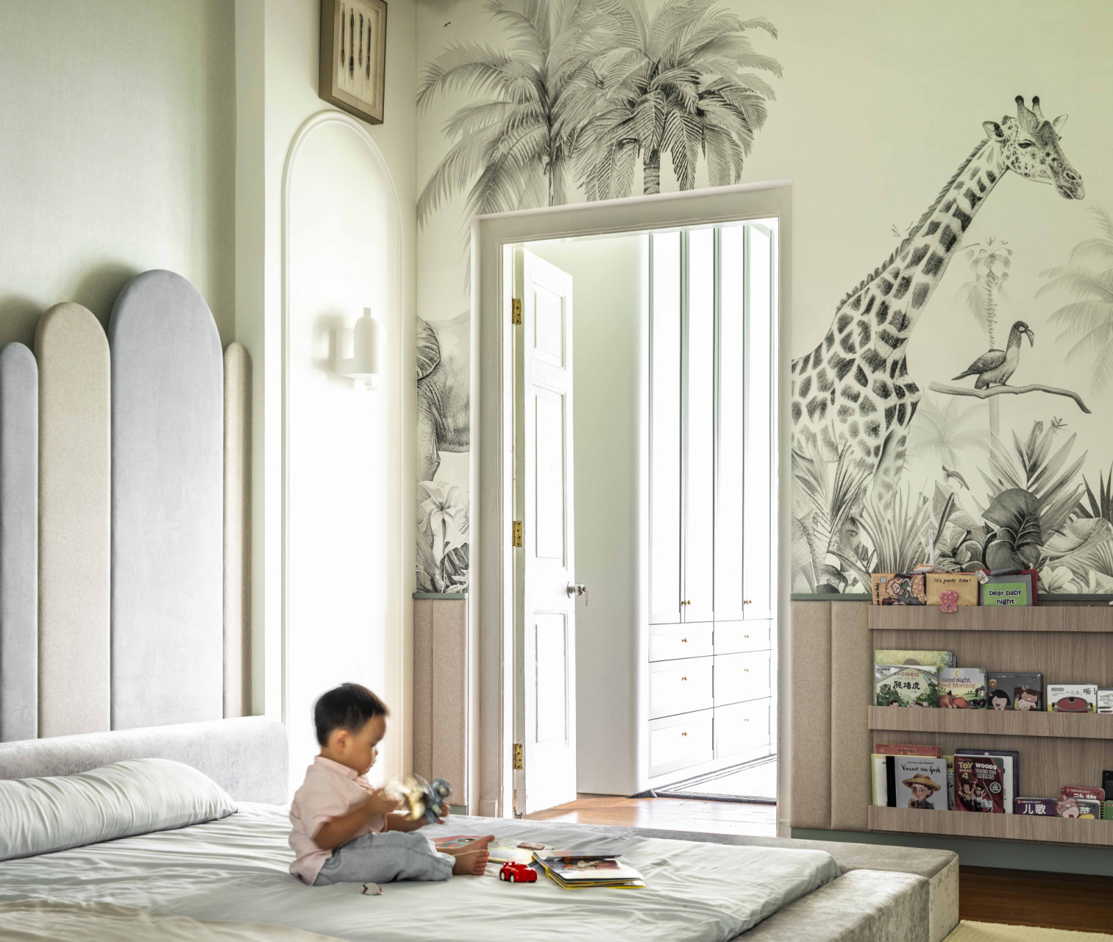 A low-slung bed and cushioned walls allow the toddler to crawl around and explore the surroundings safely