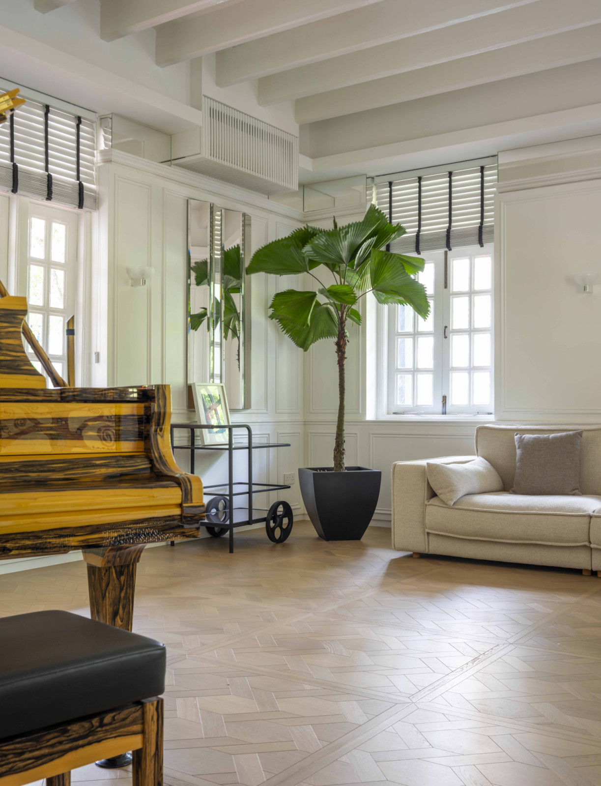 A one-of-a-kind Steinway piano presides over the black-and-white house’s salon