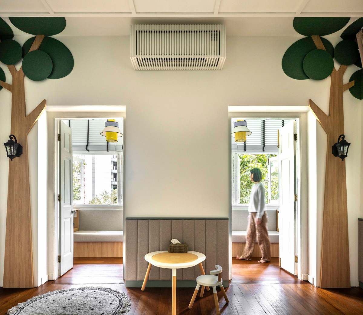 A connecting room offers caregivers a sunlit space to sit in while keeping watch