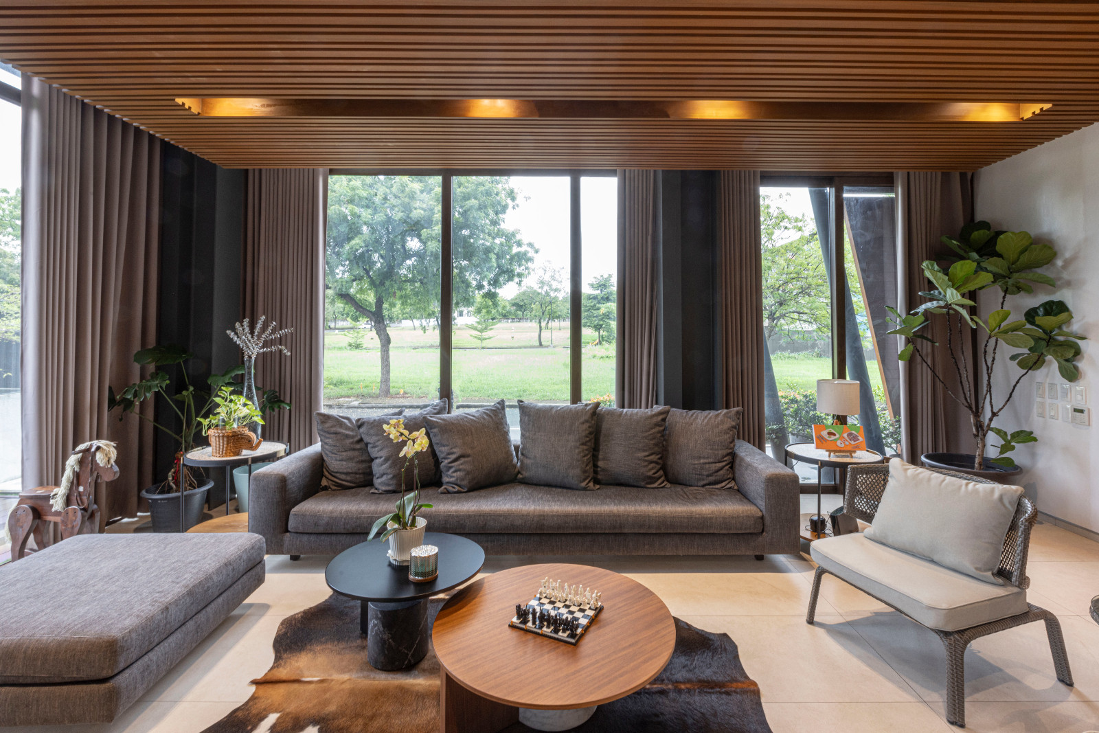 The living room area of a vertical Filipino home in Manila, Philippines, designed by Barchan + Architecture