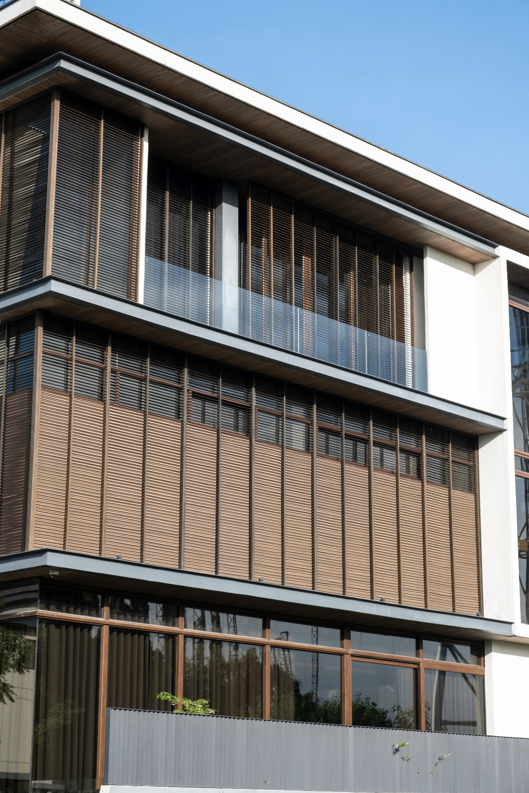 The exterior of a vertical Filipino home in Manila, Philippines, designed by Barchan + Architecture