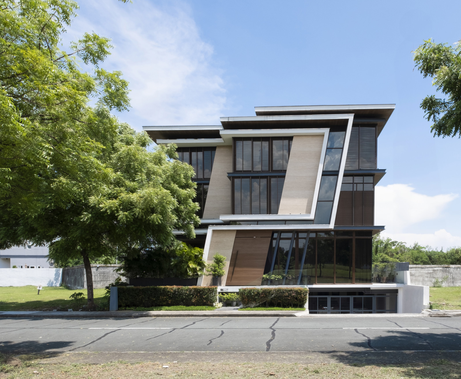 The exterior of a vertical Filipino home in Manila, Philippines, designed by Barchan + Architecture