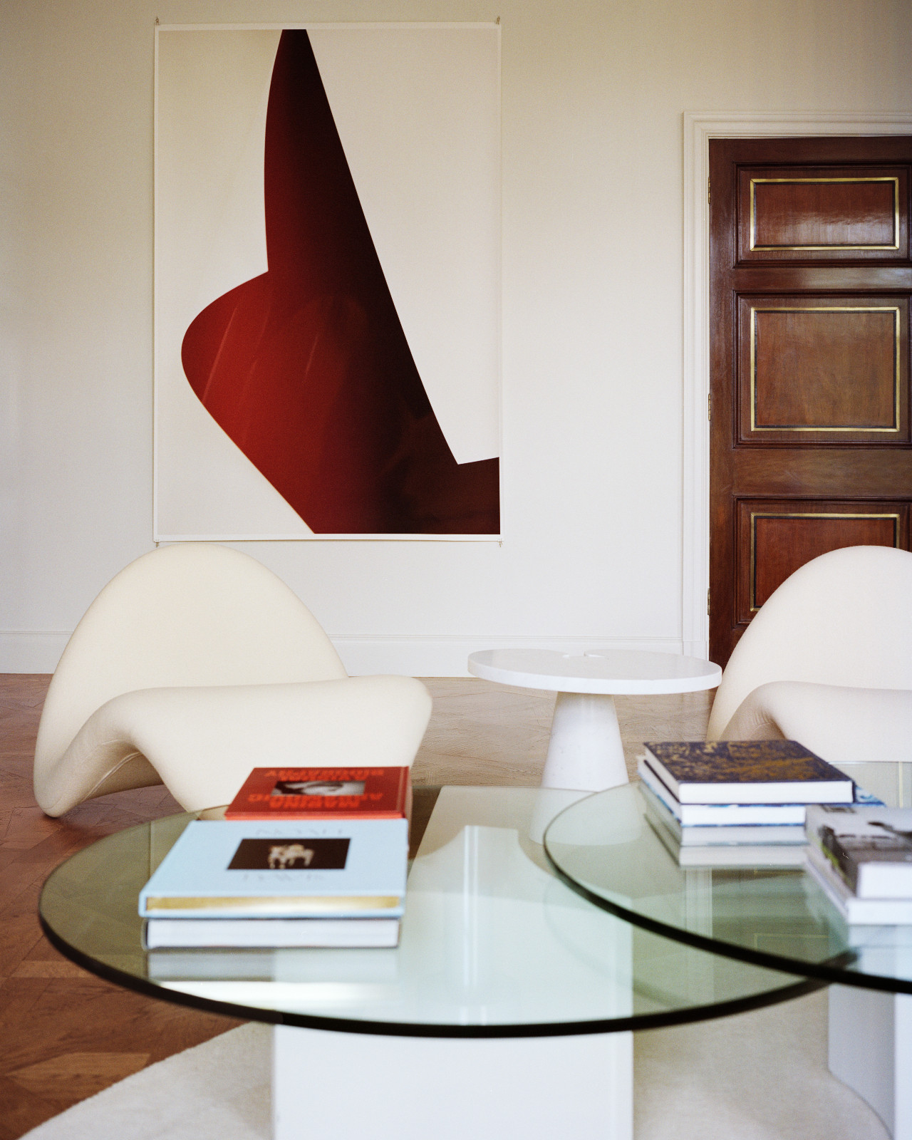 A Wolfgang Tillmans inkjet print hangs above Pierre Paulin Tongue
chairs and an Angelo Mangiarotti marble side table in Lawrence Van Hagen's London home