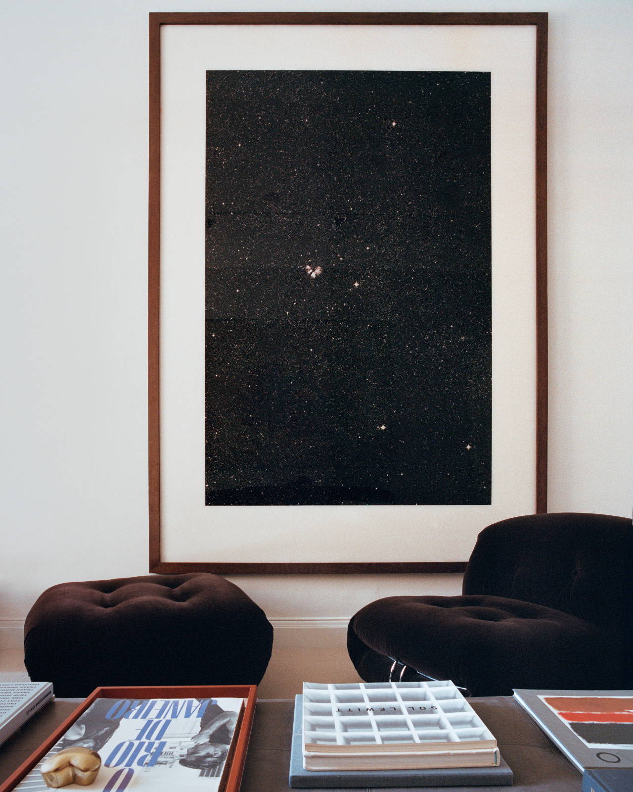 A Thomas Ruff Chromogenic print paired with a Cassina Soriana sofa chair and ottoman in Lawrence Van Hagen's London home
