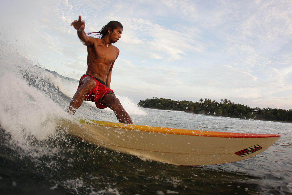 A surfer rides a wave in Cloud 9, Siargao (Photo: Getty)