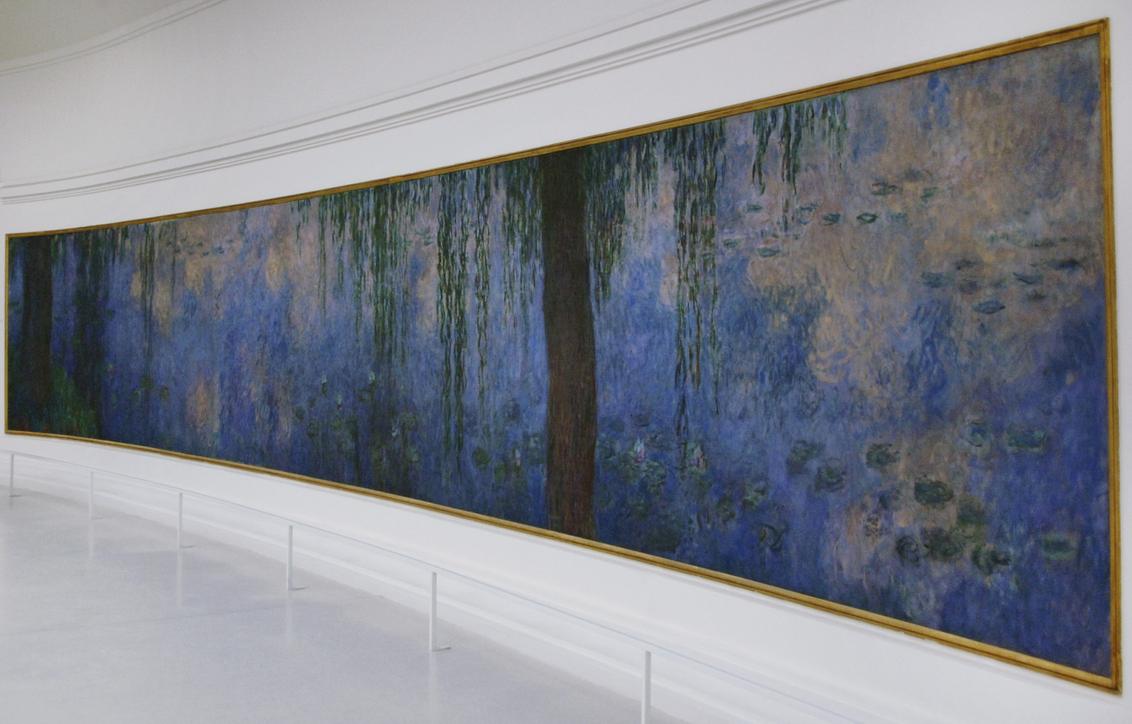Claude Monet (1840-1926). French impressionist painter. The Water Lilies: Morning with Willows, ca. 1915-1926. Oil on canvas (200 x 1275 cm). Orangerie Museum. Paris. France. (Photo by: PHAS/Universal Images Group via Getty Images)