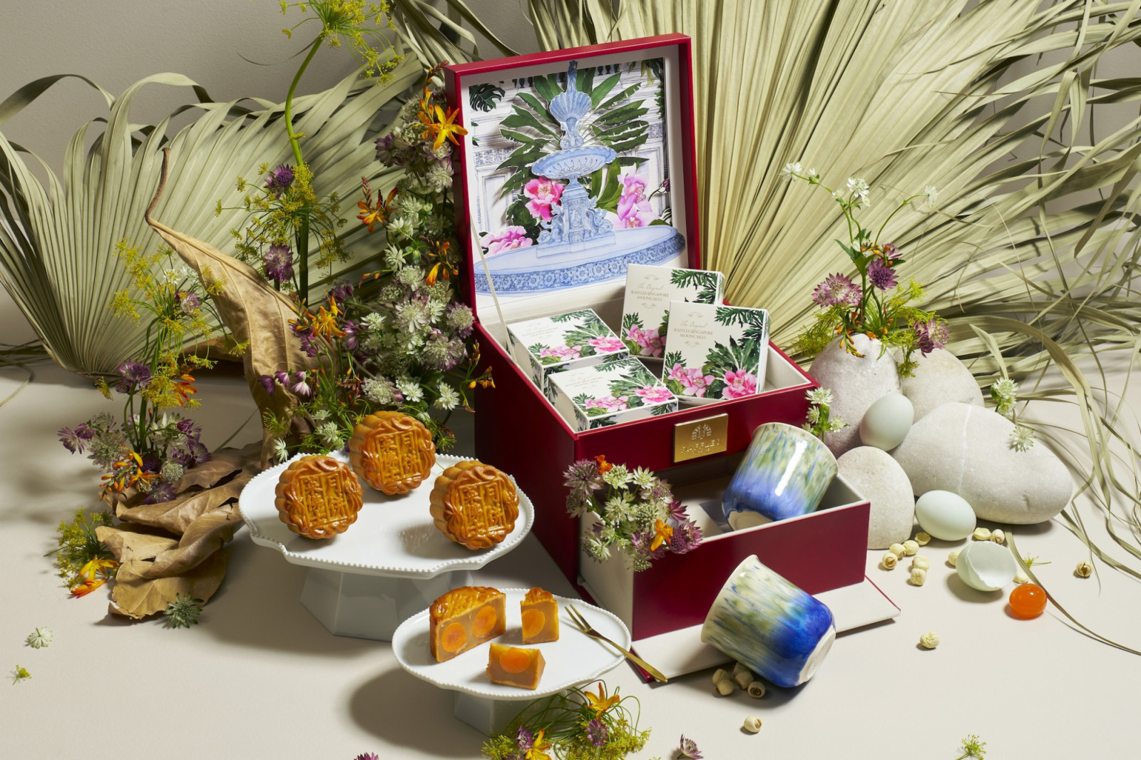 A special baked mooncake set accompanied by porcelain teacups, handcrafted by art:dis trainees and artisans (Photo: Raffles Singapore) best mooncake gift baked mooncake snowskin mooncake mid autumn festival hotel mooncake