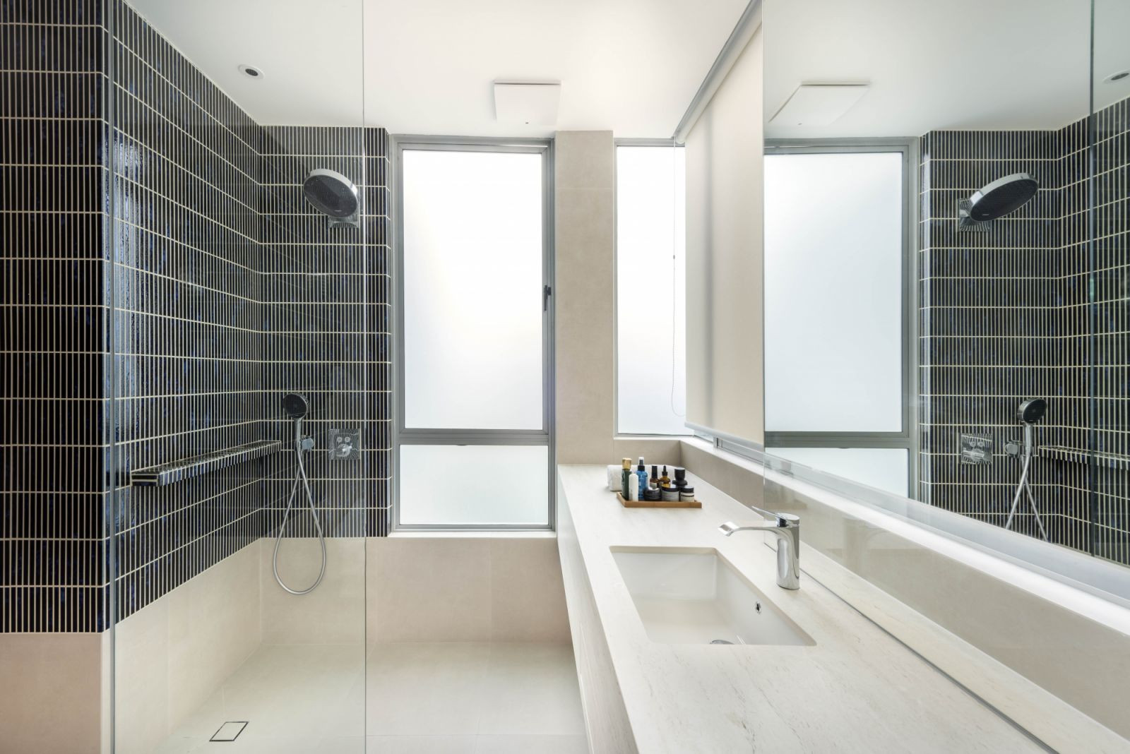A pop of green was implemented in this bathroom as well